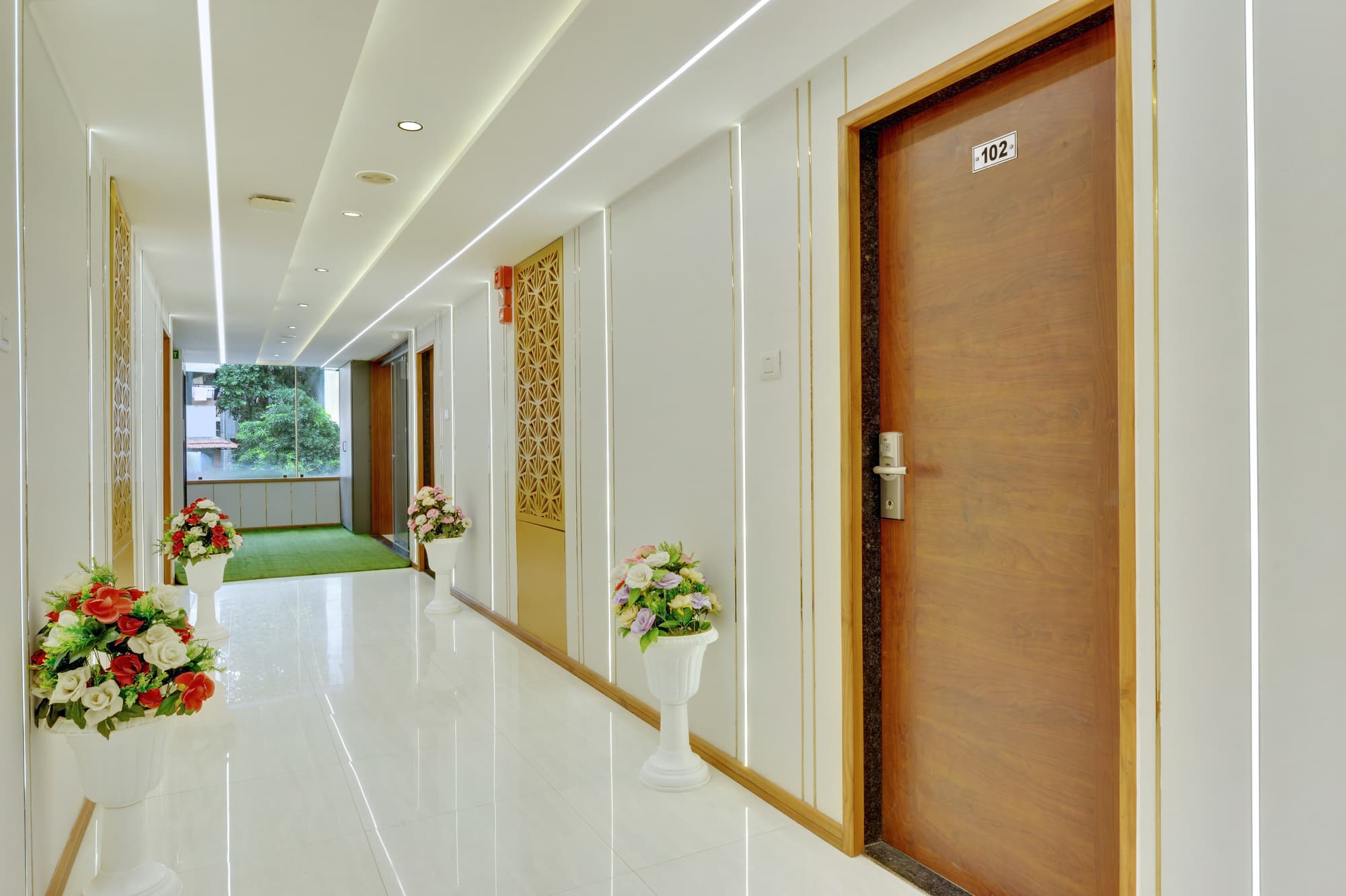 Hotel Shital Inn bright guest floor lobby corridor with room entrances